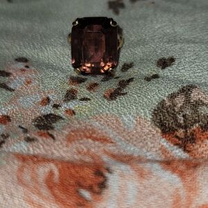 Elegant Gold Ring with Purple Gemstone